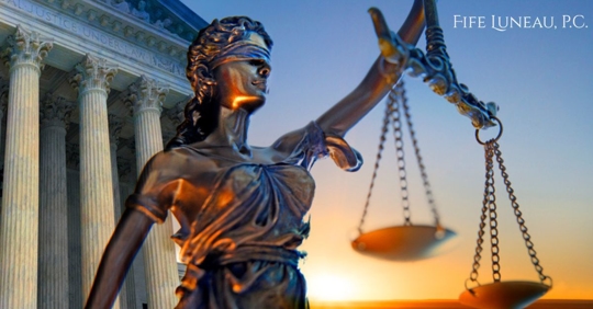 A statue of the blindfolded lady justice